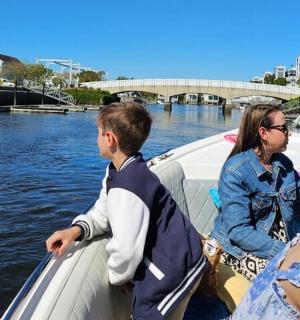 a couple of people on a boat in the water