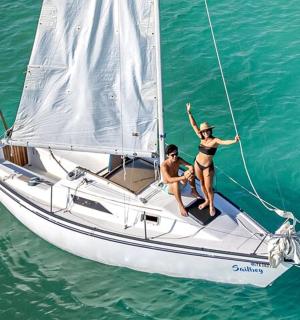 two women on a sail boat in the water