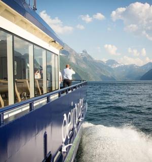 a boat on a body of water with people on it