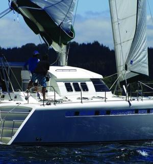 a man on a sail boat in the water