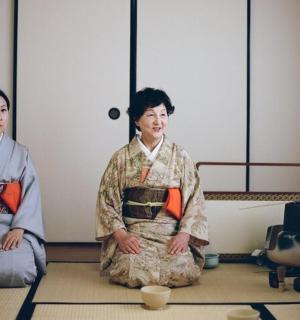 two women sitting on the floor in a room