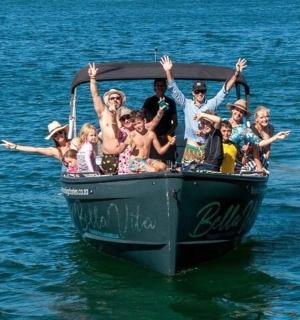 a group of people on a boat in the water