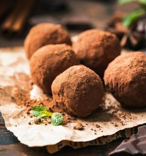 a pile of chocolate truffles on a table