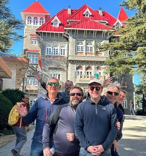 a group of people standing in front of a building
