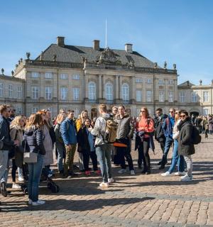 a group of people standing in front of a building