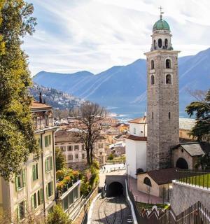 a tall building with a clock tower in a town