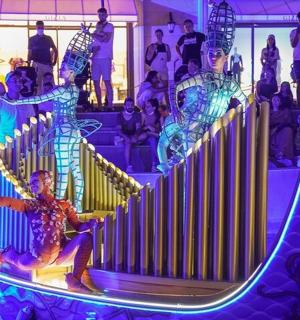 a man sitting on a slide at a party