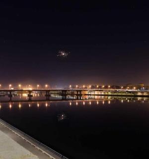 a bridge over a body of water at night