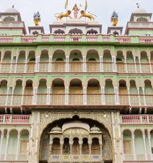 a large building with ahtar gate in front of it