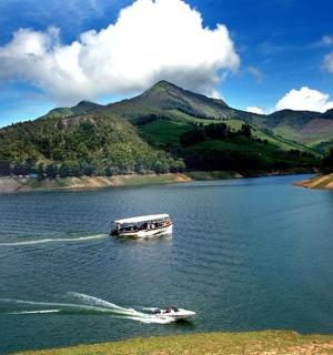 two boats on a lake with mountains in the background