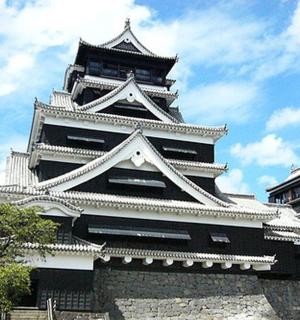 a large white building with a sky in the background