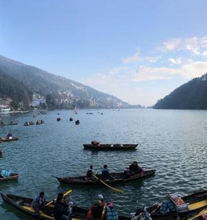 a group of people in boats on a lake