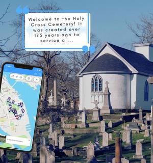 a person holding a cell phone in front of a church