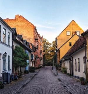 a cobblestone street in an old town with buildings