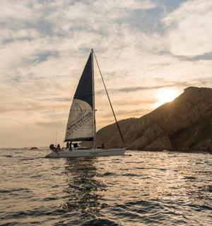a sailboat in the water on the ocean