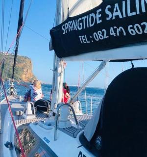 a group of people on a boat in the water
