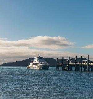 a boat is docked at a dock in the water