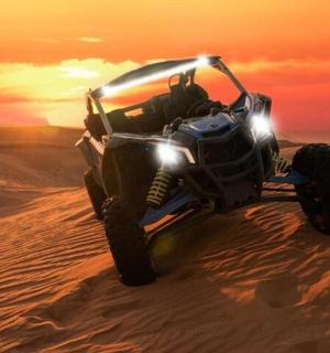 a atv in the sand in the desert