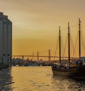 a boat in the water with a group of people on it