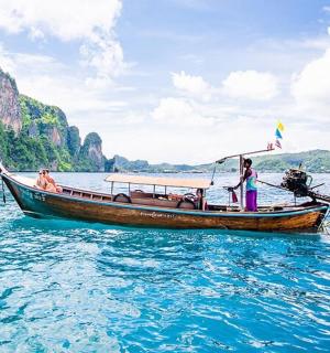 a group of people on a boat in the water