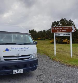 a white van parked next to a street sign
