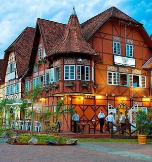 a large building with people standing in front of it