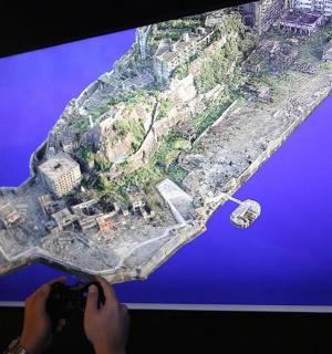 a person holding a video game controller in front of a tv