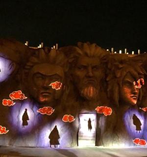 a halloween display of a haunted house at night
