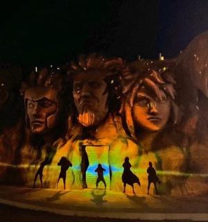 a painting of a group of people on a wall