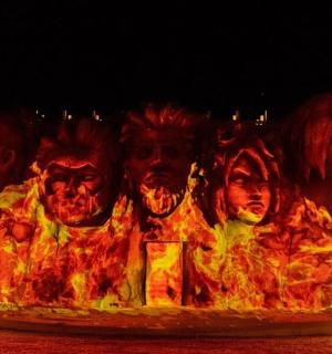 a group of faces on a pizza in fire