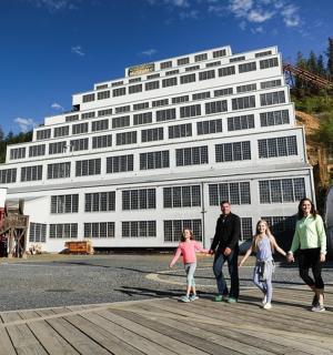 a group of people walking in front of a building