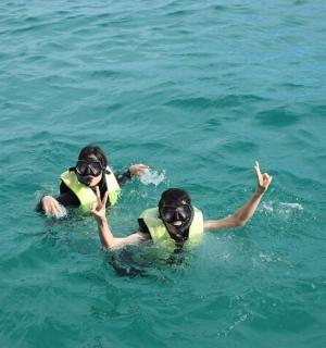 two people in the water in the ocean