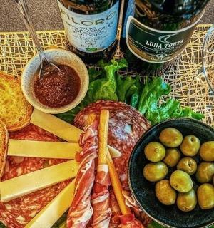 a plate of food with meat and vegetables on a table