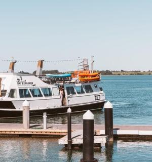 a boat is docked at a dock in the water