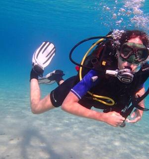 a person in the water wearing a diver gear