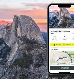 two cell phones with a view of a mountain