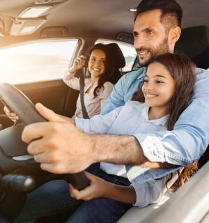 a group of people sitting in a car