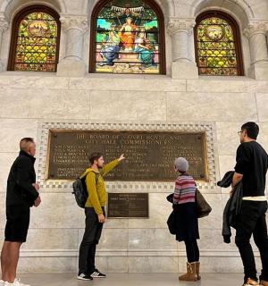 a group of people standing in front of a monument