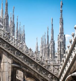 a cathedral with many spires on the side of a building