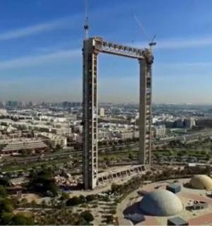 an overhead view of a city with a large structure