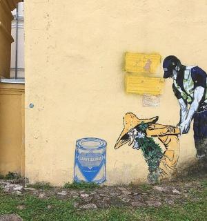 un dipinto di un uomo e un cane su un muro