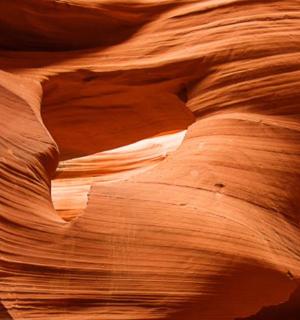 a view of a slot canyon with a rock formation