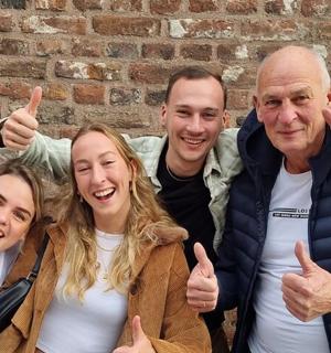 a group of people giving the thumbs up