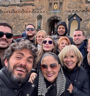a group of people standing in front of a building