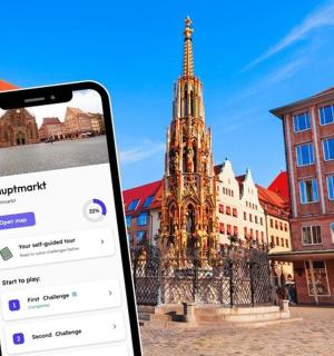 a cell phone in front of a building with a tower