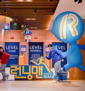 a group of people playing with a statue in a room