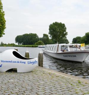 two boats are docked at a dock in the water
