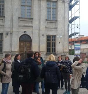 a group of people standing in front of a building