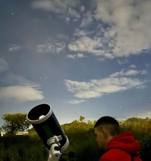 a man is standing next to a baseball bat