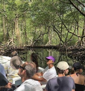 a group of people on a boat in the water